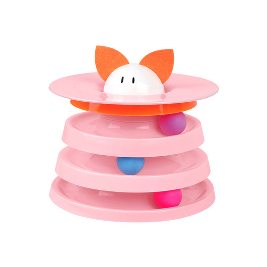 Brown tabby cat sniffing a black and orange multi-level rotating cat plate toy with colorful balls and bunny ears.
