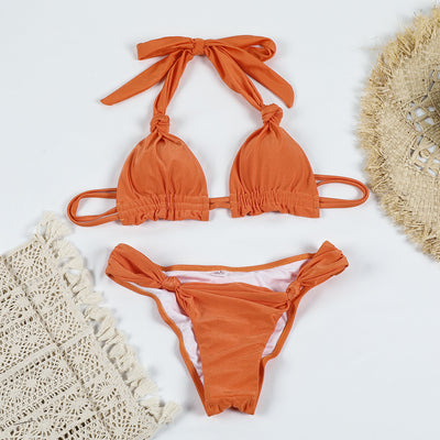 Orange pure color bikini with knotted halter top and banded thong bottoms, displayed flat on a white background. - Image 7