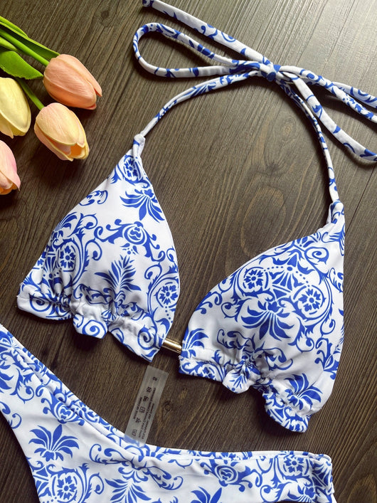 Women's blue and white porcelain print halter bikini with tie-side bottoms and blue tassels. - Image 11