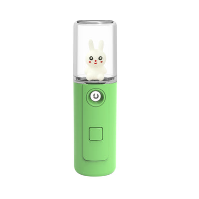 Green portable facial mister with a clear top and a white cartoon rabbit figure inside, featuring a power button. - Image 2