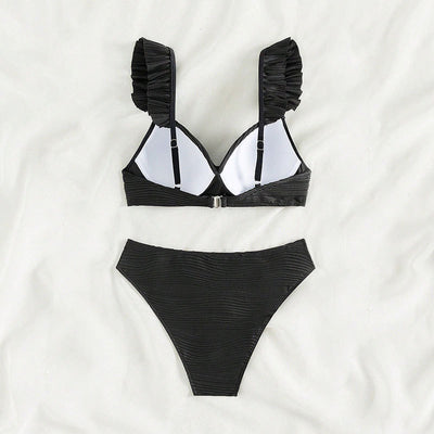 Black ruched high-waisted bikini swimsuit with ruffled shoulder straps and a twisted front detail. - Image 4