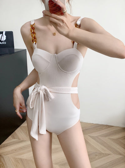 Black ribbed one-piece swimsuit with sweetheart neckline, chain-link shoulder strap, side cut-outs, and self-tie waist. - Image 20