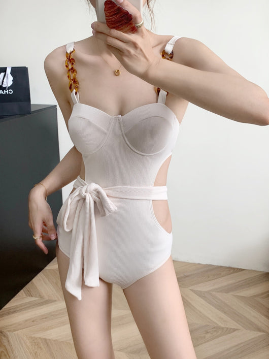 Black ribbed one-piece swimsuit with sweetheart neckline, chain-link shoulder strap, side cut-outs, and self-tie waist. - Image 20
