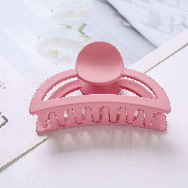 Frosted light blue rectangular hair claw clip with a gold-toned spring mechanism, ideal for securing hair.