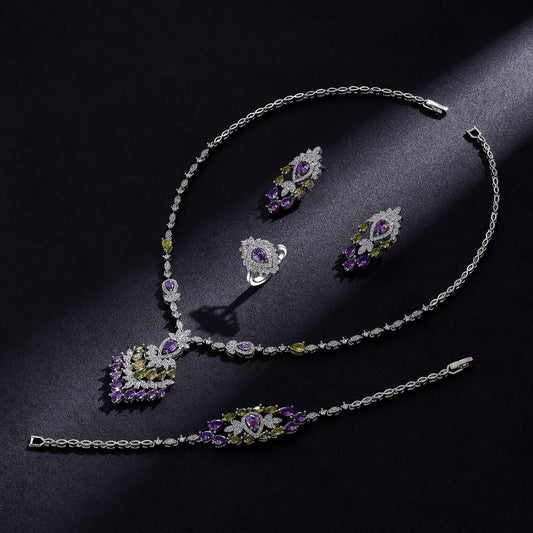 Color zirconium necklace, earrings, bracelet, and ring 4-piece set with purple and green stones.