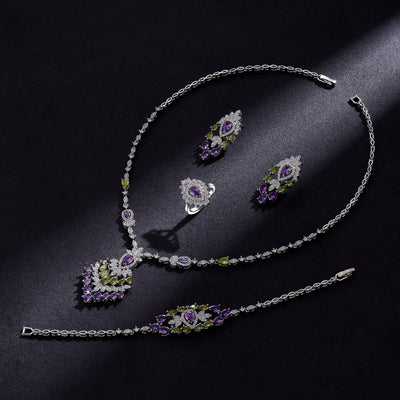 Color zirconium necklace, earrings, bracelet, and ring 4-piece set with purple and green stones.
