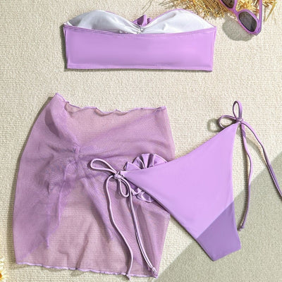 Women's blue tube top swimsuit with a large 3D flower, tie-side bikini bottoms, and a sheer sarong skirt. - Image 4
