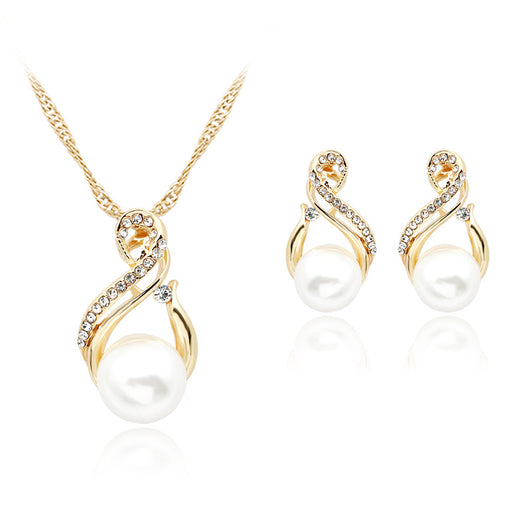 Gold-tone necklace and matching earrings featuring white faux pearls and clear rhinestones in an elegant twisted design.