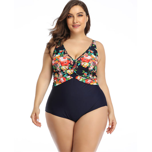 Plus size one-piece swimsuit with a red tropical leaf print top and solid dark red bottom, featuring a crossover chest. - Image 9