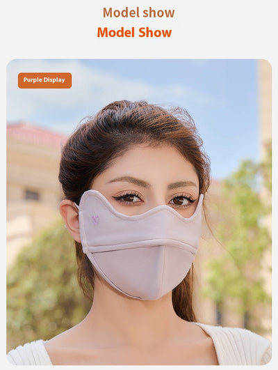 Woman wearing a grey outdoor cycling wind mask with ear hooks and a small heart logo, designed for cold-proof eye protection. - Image 25