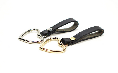 Black imitation leather belt with a silver heart-shaped pin buckle and a dangling silver heart charm. - Image 7