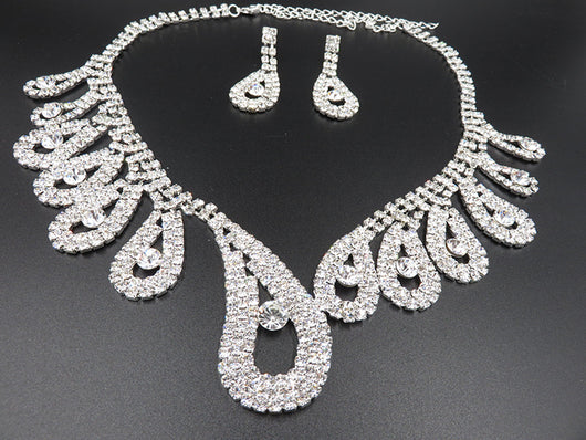 Silver-toned rhinestone necklace and matching drop earrings set with iridescent accents, ideal for bridal or formal wear. - Image 5