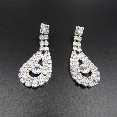 Silver-toned rhinestone necklace and matching drop earrings set with iridescent accents, ideal for bridal or formal wear. - Image 3