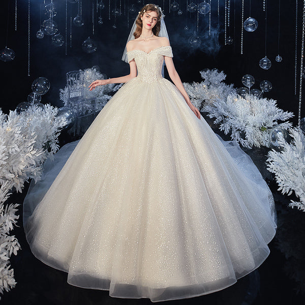 Vestido de Novia Asimétrico con Detalles Estelares y Cola Fluida - Image 17