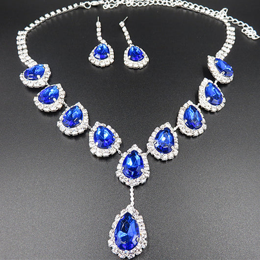 Bridal jewelry set with a silver-tone necklace and matching drop earrings, featuring orange teardrop rhinestones. - Image 3