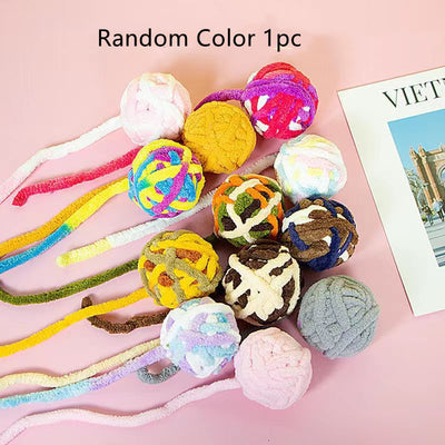 Colorful plush wool ball cat toys with long yarn tails, featuring various patterns and a bell inside for play. - Image 6