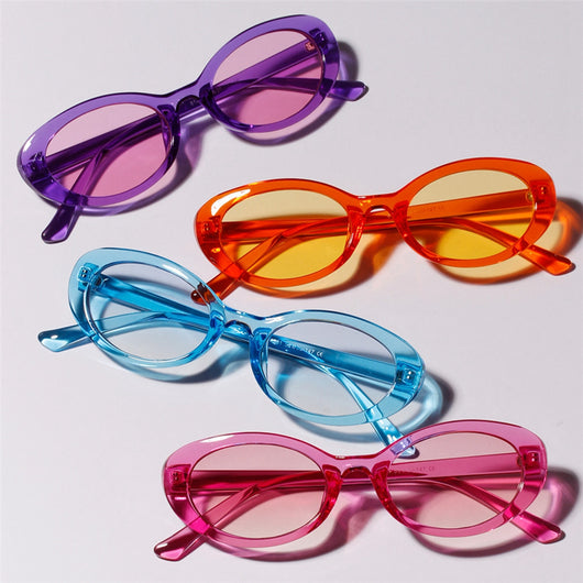 Translucent blue small frame oval sunglasses with light blue lenses on a white background.