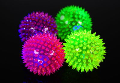 Four glowing sea urchin balls in neon pink, green, and yellow, with soft rubber spikes, for pets. - Image 7