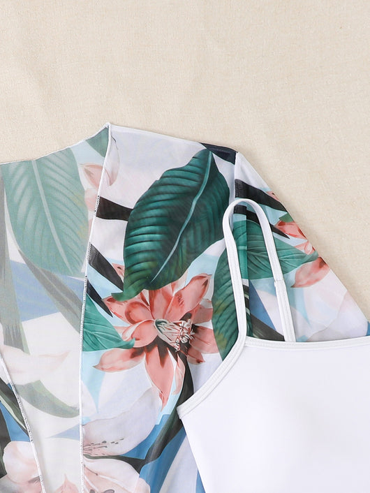 Woman in a three-piece bikini swimsuit set with a black tube top, floral boy shorts, and a sheer floral kimono cover-up. - Image 31