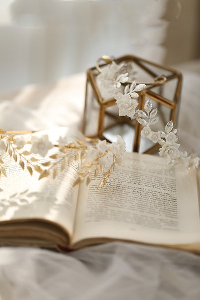 Silver-toned hair band with white ceramic flowers, faux pearls, and delicate silver leaves, perfect for bridal wear. - Image 9
