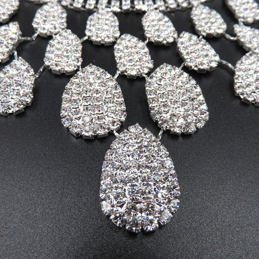 Sparkling silver-tone necklace with multiple teardrop-shaped rhinestone pendants, ideal for wedding or evening wear. - Image 2