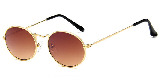 Retro round sunglasses with pink lenses and a gold-colored metal frame, featuring black ear tips. - Image 6
