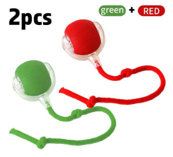 Two cat rolling ball toys, one red and one green, with clear plastic and knotted cords, on a white background. - Image 15