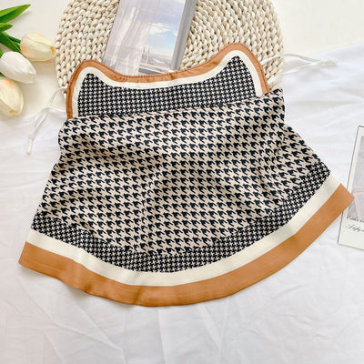 Female cream and black floral polka dot sun protection mask with ear loops, designed for eye corner protection. - Image 17