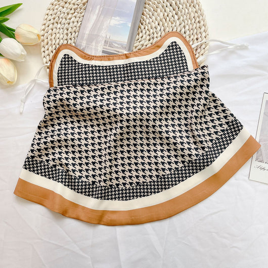 Female cream and black floral polka dot sun protection mask with ear loops, designed for eye corner protection. - Image 17