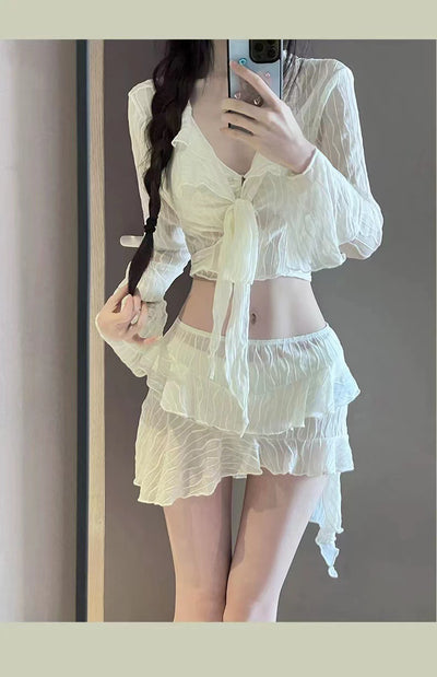 White four-piece bikini swimsuit set for women, featuring a long-sleeve tie-front top and tiered ruffle skirt. - Image 8