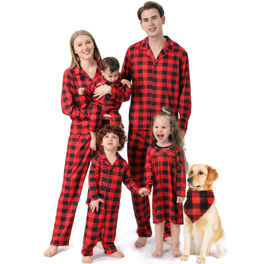 Baby in a red and black buffalo plaid long-sleeve pajama romper, viewed from the back with arms raised. - Image 31