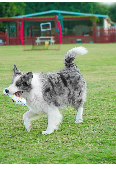 White bone-shaped dog toy with colorful speckles, labeled as interactive and bite-resistant. - Image 12