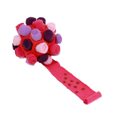 Red rubber pet sniff ball with pink, purple, and dark purple fleece rolls, featuring a treat-holding strap. - Image 5
