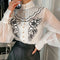 Blusa Elegante con Mangas Linterna y Flores Bordadas