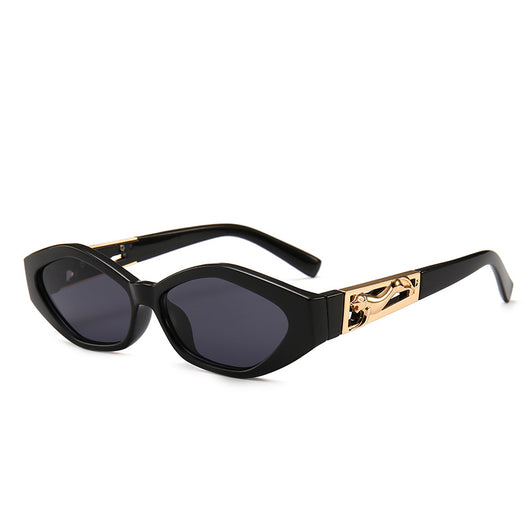 Angular cat-eye sunglasses with a tortoiseshell frame, brown gradient lenses, and gold jumping cheetah temple details. - Image 5