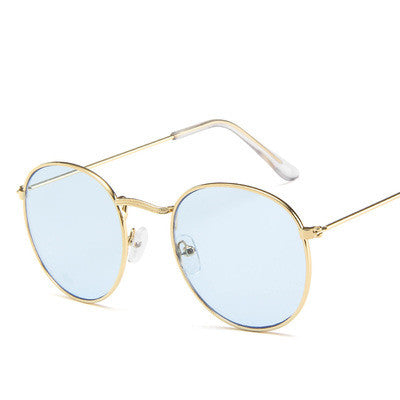 Round frame vintage sunglasses with silver metal frames and dark gray lenses on a white background. - Image 22