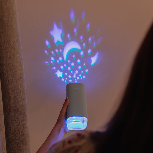 Light blue aromatherapy machine and projection humidifier with a gold 'V' logo and translucent base. - Image 3