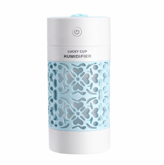 Light blue and white Lucky Cup humidifier with a decorative heart and floral cutout pattern. Features a power button. - Image 7