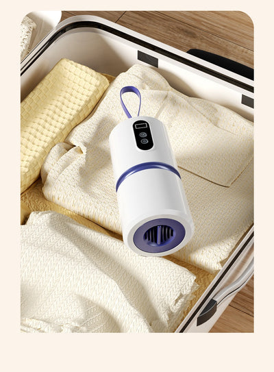 White and blue mini household air dryer with a digital display and hanging loop, shown next to a gold smartphone. - Image 11