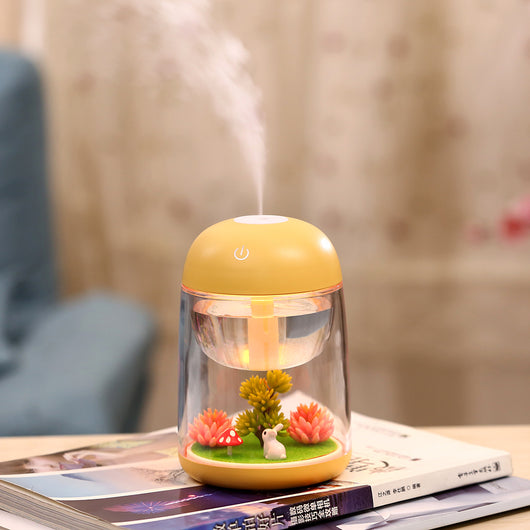 Pink and clear columnar humidifier with a micro landscape inside, featuring a white rabbit, red mushroom, and artificial plants. - Image 8