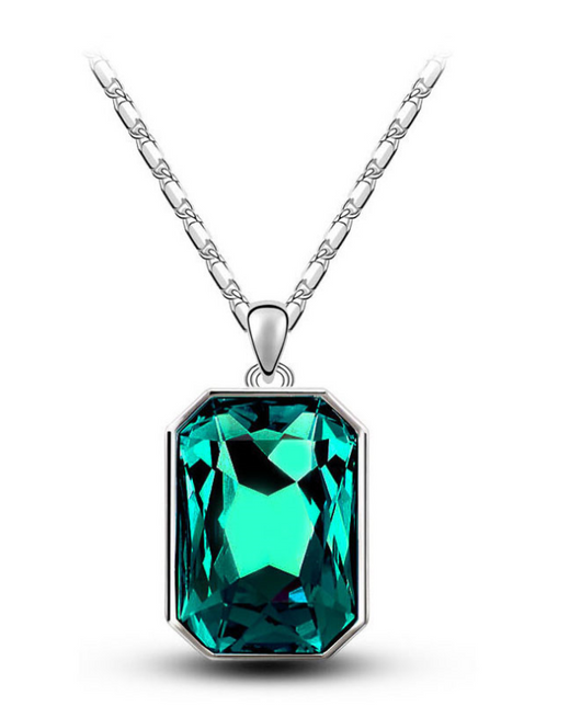 Teal rectangular crystal necklace and matching stud earrings set with silver-toned settings and chain. - Image 9