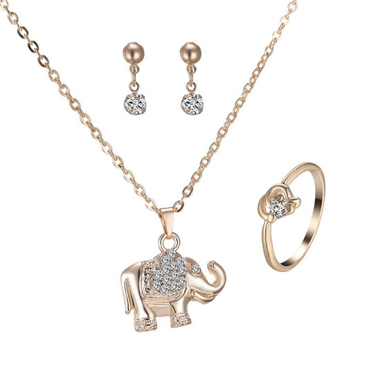 Rose gold-toned jewelry set with an elephant pendant necklace, matching rhinestone drop earrings, and a heart-knot ring. - Image 2