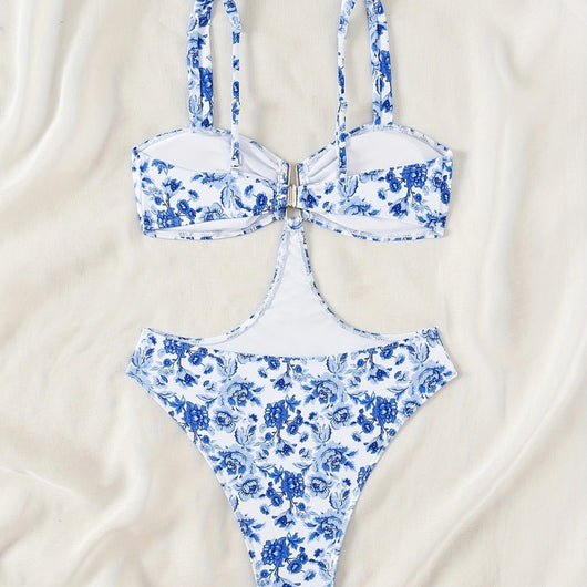 Blue and white floral one-piece swimsuit with a V-bar detail and side cut-outs, perfect for summer. - Image 3