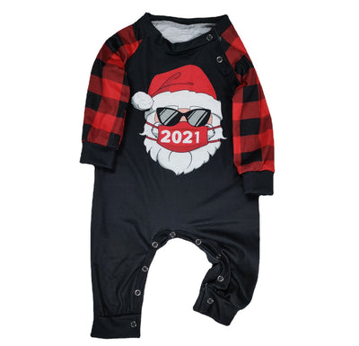 Family matching Christmas pajamas with a Santa Claus graphic wearing sunglasses and a '2021' mask, paired with red and black buffalo plaid pants. - Image 5