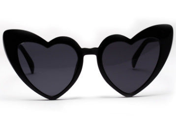 Heart-shaped tortoiseshell sunglasses with light brown lenses on a white background, perfect for women. - Image 2
