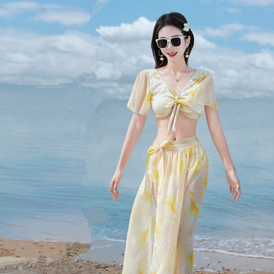 Women's light blue tropical leaf print three-piece swimsuit with short sleeve bikini top, bottoms, and sarong skirt. - Image 19