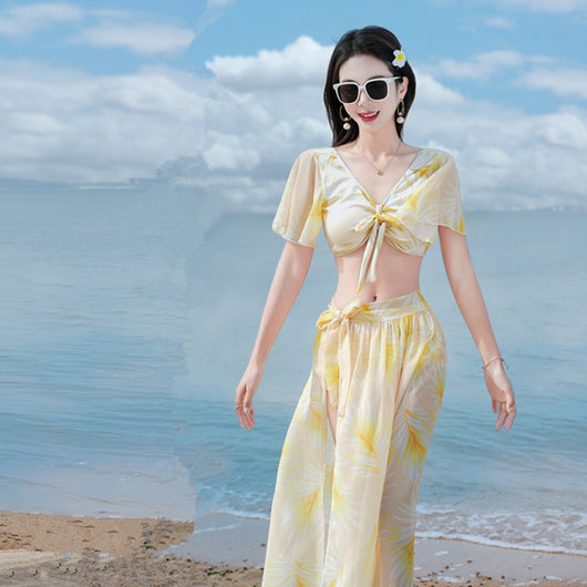 Women's light blue tropical leaf print three-piece swimsuit with short sleeve bikini top, bottoms, and sarong skirt. - Image 19