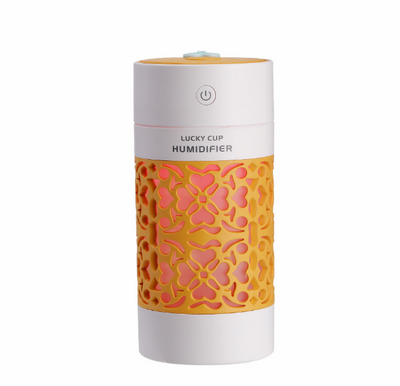 Light blue and white Lucky Cup humidifier with a decorative heart and floral cutout pattern. Features a power button. - Image 9