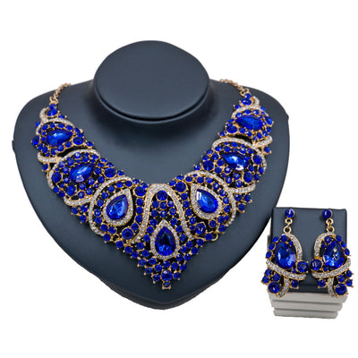 Exaggerated blue rhinestone and pearl bridal necklace and earring set with silver-tone alloy plating. - Image 6
