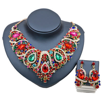 Exaggerated blue rhinestone and pearl bridal necklace and earring set with silver-tone alloy plating. - Image 3